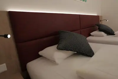 Ein Bett oder Betten in einem Zimmer der Unterkunft Galeria Airport Hotel
