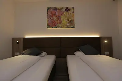 Ein Bett oder Betten in einem Zimmer der Unterkunft Galeria Airport Hotel
