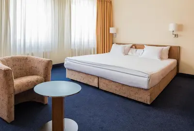 Ein Bett oder Betten in einem Zimmer der Unterkunft Hotel Residenz Limburgerhof