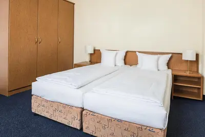 Ein Bett oder Betten in einem Zimmer der Unterkunft Hotel Residenz Limburgerhof