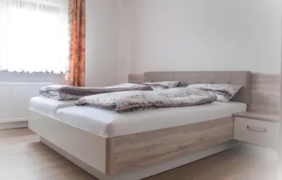 Ein Bett oder Betten in einem Zimmer der Unterkunft Landhaus Maria