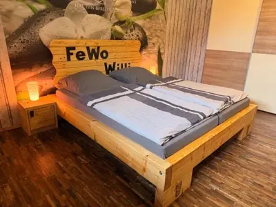 Ein Bett oder Betten in einem Zimmer der Unterkunft Ferienwohnung Haus Willi