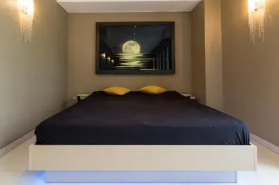 Ein Bett oder Betten in einem Zimmer der Unterkunft Wellness- und Gartenhotel Heusser