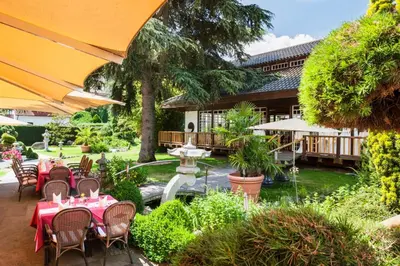 Ein Garten an der Unterkunft Wellness- und Gartenhotel Heusser