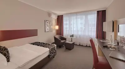 Ein Bett oder Betten in einem Zimmer der Unterkunft Best Western Hotel Darmstadt Mitte