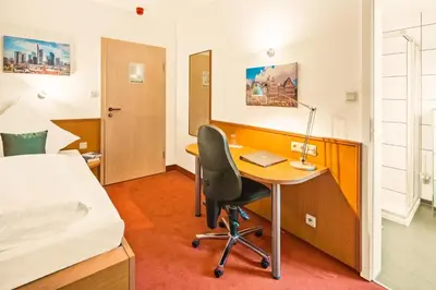 Ein Bett oder Betten in einem Zimmer der Unterkunft L'Escala