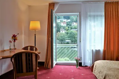 Ein Bett oder Betten in einem Zimmer der Unterkunft Hotel Neckarlux