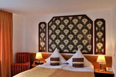 Ein Bett oder Betten in einem Zimmer der Unterkunft Hotel Neckarlux