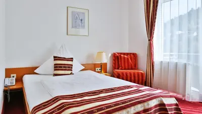 Ein Bett oder Betten in einem Zimmer der Unterkunft Hotel Neckarlux
