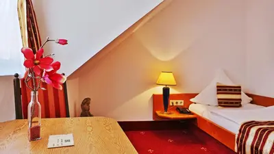 Ein Bett oder Betten in einem Zimmer der Unterkunft Hotel Neckarlux