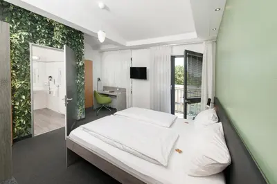 Ein Bett oder Betten in einem Zimmer der Unterkunft Hotel INNdependence