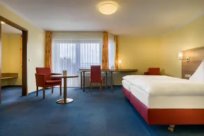 Ein Bett oder Betten in einem Zimmer der Unterkunft acora Karlsruhe Zentrum Living the City