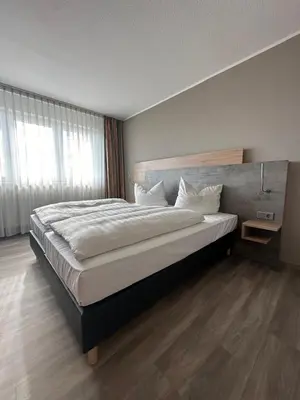 Ein Bett oder Betten in einem Zimmer der Unterkunft Rheinhessen Inn GmbH