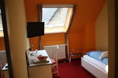 Ein Bett oder Betten in einem Zimmer der Unterkunft Hotel Hirsch