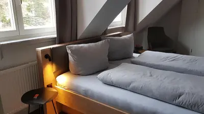 Ein Bett oder Betten in einem Zimmer der Unterkunft Hotel Hirsch