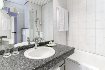 Ein Badezimmer in der Unterkunft NH Weinheim