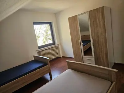 Ein Bett oder Betten in einem Zimmer der Unterkunft Monteurwohnung - Business Apartment