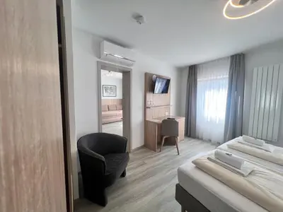 Ein Bett oder Betten in einem Zimmer der Unterkunft Hotel Kriemhilde
