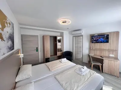 Ein Bett oder Betten in einem Zimmer der Unterkunft Hotel Kriemhilde