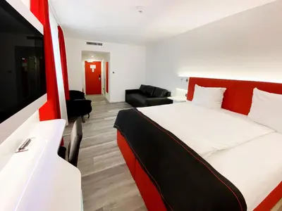 Ein Bett oder Betten in einem Zimmer der Unterkunft DORMERO Hotel Darmstadt