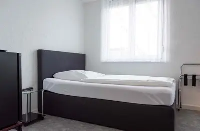 Ein Bett oder Betten in einem Zimmer der Unterkunft Cocco-Bello Smart Check-in Hotel