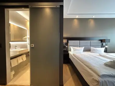 Ein Bett oder Betten in einem Zimmer der Unterkunft Hotel am Karlstor