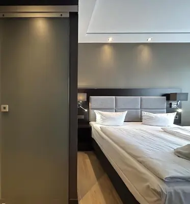 Ein Bett oder Betten in einem Zimmer der Unterkunft Hotel am Karlstor