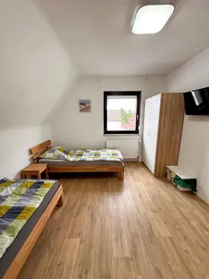 Ein Bett oder Betten in einem Zimmer der Unterkunft Wohnen BI