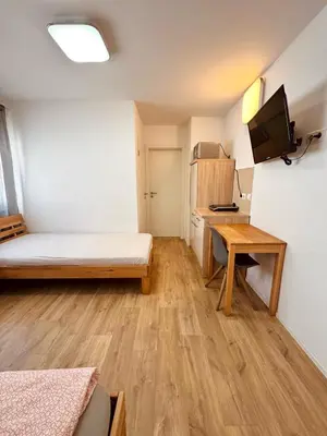 Ein Bett oder Betten in einem Zimmer der Unterkunft Wohnen BI