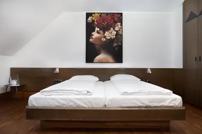 Ein Bett oder Betten in einem Zimmer der Unterkunft Stadthotel Heilbronn