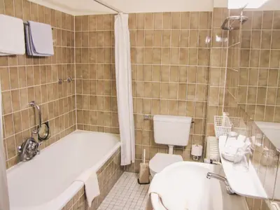 Ein Badezimmer in der Unterkunft Hotel Harzer am Kurpark