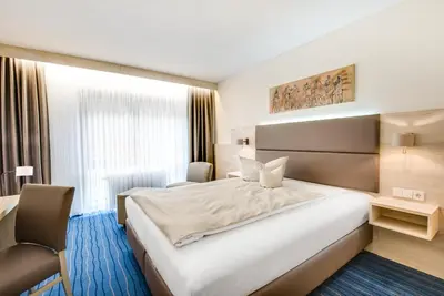 Ein Bett oder Betten in einem Zimmer der Unterkunft Business Class Hotel Häckermühle