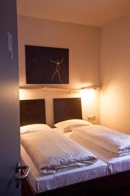 Ein Bett oder Betten in einem Zimmer der Unterkunft Hotel Speyer am Technik Museum