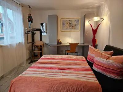 Ein Bett oder Betten in einem Zimmer der Unterkunft Komfortables 3-Zimmer Apartment in Schwetzingen zwischen Mannheim und Heidelberg