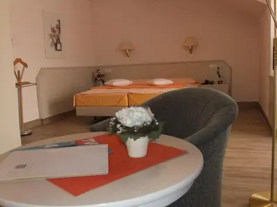Ein Bett oder Betten in einem Zimmer der Unterkunft Hotel Garni Classico