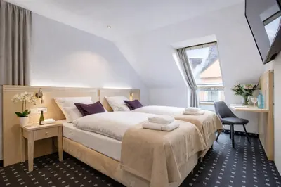Ein Bett oder Betten in einem Zimmer der Unterkunft Rhein Neckar Hotel 24h Self Check-in