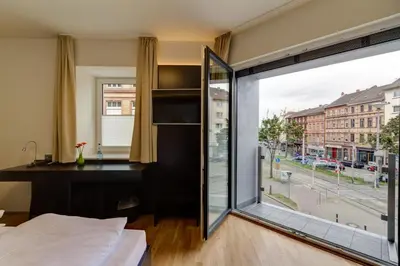 Ein Bett oder Betten in einem Zimmer der Unterkunft sevenDays Hotel BoardingHouse Mannheim