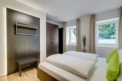 Ein Bett oder Betten in einem Zimmer der Unterkunft sevenDays Hotel BoardingHouse Mannheim