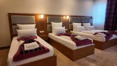 Ein Bett oder Betten in einem Zimmer der Unterkunft Airport Global Hotel