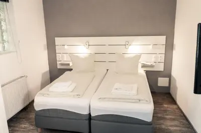Ein Bett oder Betten in einem Zimmer der Unterkunft Hotel Scharfes Eck