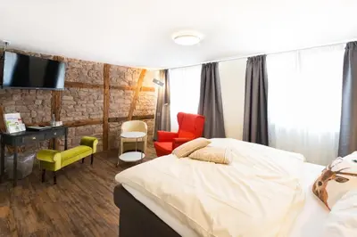 Ein Bett oder Betten in einem Zimmer der Unterkunft Flair Hotel Hopfengarten
