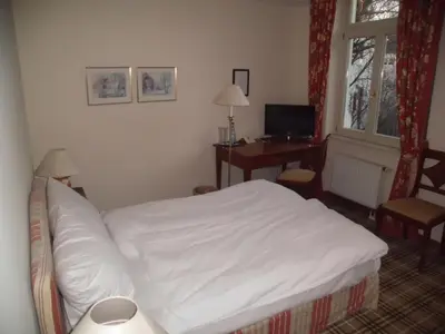 Ein Bett oder Betten in einem Zimmer der Unterkunft Hotel Freihof