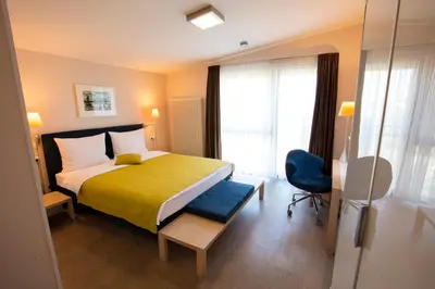Ein Bett oder Betten in einem Zimmer der Unterkunft Maurers Zollamt Hotel