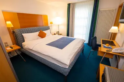 Ein Bett oder Betten in einem Zimmer der Unterkunft Maurers Zollamt Hotel