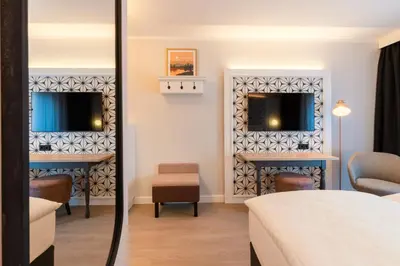 Ein Bett oder Betten in einem Zimmer der Unterkunft Garner Hotel Mannheim City by IHG