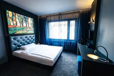 Ein Bett oder Betten in einem Zimmer der Unterkunft Hotel Der Blaue Reiter Design- & Tagungshotel