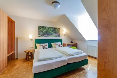 Ein Bett oder Betten in einem Zimmer der Unterkunft Stadthotel