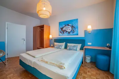 Ein Bett oder Betten in einem Zimmer der Unterkunft Stadthotel