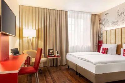 Ein Bett oder Betten in einem Zimmer der Unterkunft Amedia Plaza Speyer, Trademark Collection by Wyndham