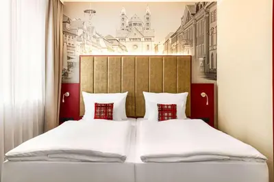 Ein Bett oder Betten in einem Zimmer der Unterkunft Amedia Plaza Speyer, Trademark Collection by Wyndham